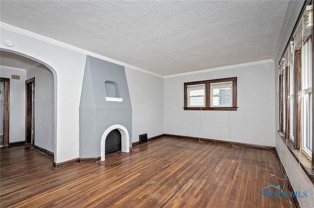 2517 Montebello Rd, Toledo, OH 43607 - unfurnished living room with wood-type flooring, crown molding, and a textured ceiling