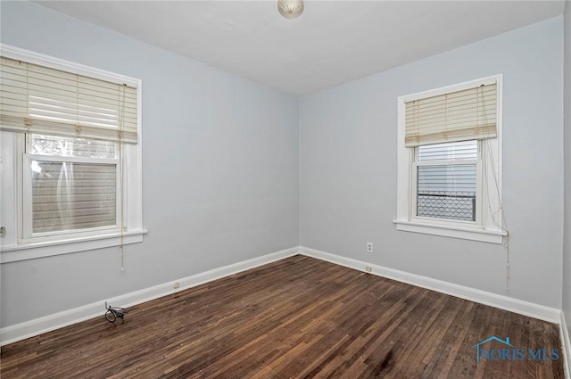 2517 Montebello Rd, Toledo, OH 43607 - spare room with dark wood-type flooring and baseboards