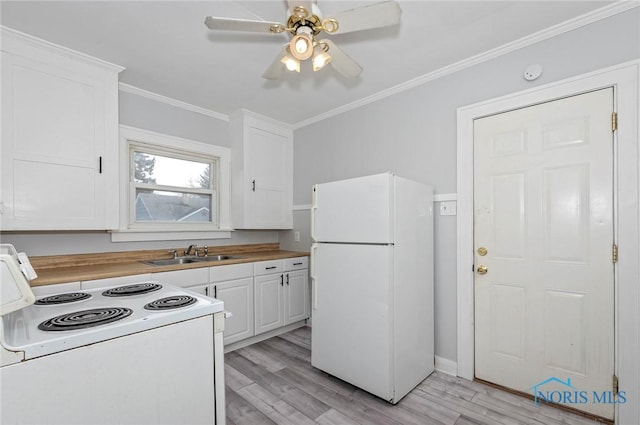 2517 Montebello Rd, Toledo, OH 43607 - kitchen with white appliances, white cabinetry, crown molding, light wood-type flooring, and ceiling fan