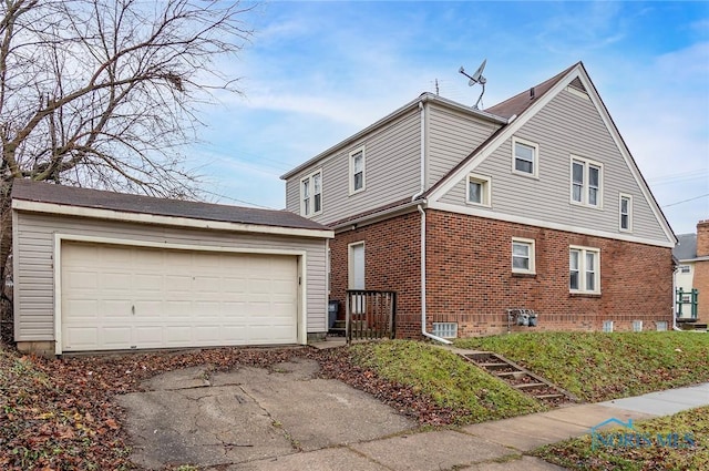 2517 Montebello Rd, Toledo, OH 43607 - view of home's exterior with an outbuilding, a garage, and brick siding