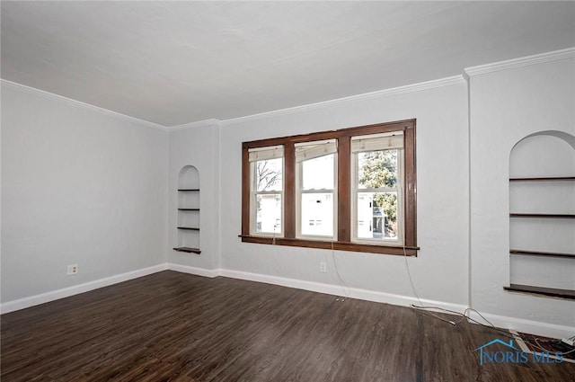 2517 Montebello Rd, Toledo, OH 43607 - empty room featuring built in features, dark wood-type flooring, and crown molding