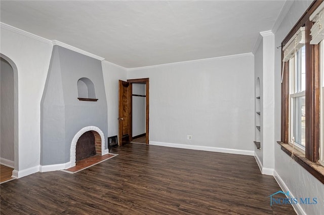 2517 Montebello Rd, Toledo, OH 43607 - unfurnished living room featuring a fireplace, dark wood-type flooring, ornamental molding, and arched walkways