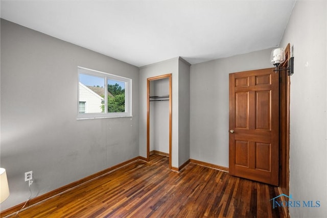 5201 Arbor Way, Sylvania, OH 43560 - unfurnished bedroom with dark wood-style flooring and a closet