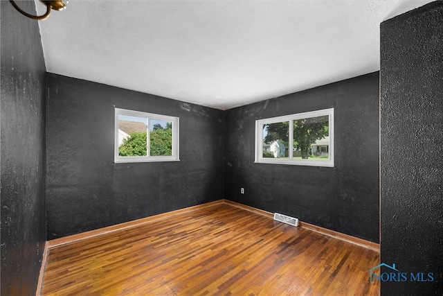 5201 Arbor Way, Sylvania, OH 43560 - spare room featuring wood finished floors and healthy amount of natural light