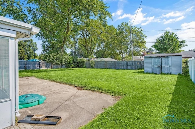 3253 Radford Dr, Toledo, OH 43614 - fenced backyard featuring a storage unit and a patio area