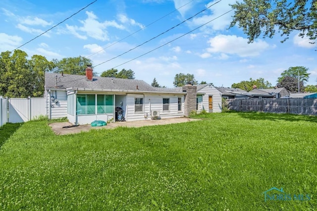 3253 Radford Dr, Toledo, OH 43614 - rear view of property featuring a chimney, a fenced backyard, and a patio area
