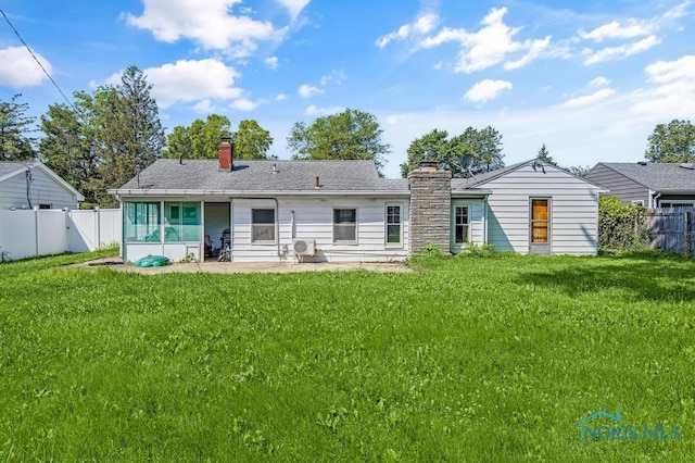 3253 Radford Dr, Toledo, OH 43614 - back of property with a chimney, a patio, and a fenced backyard