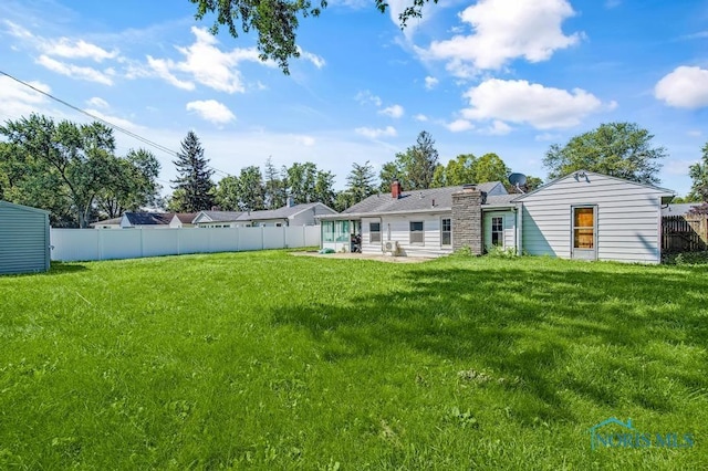 3253 Radford Dr, Toledo, OH 43614 - view of yard featuring a patio area and a sunroom