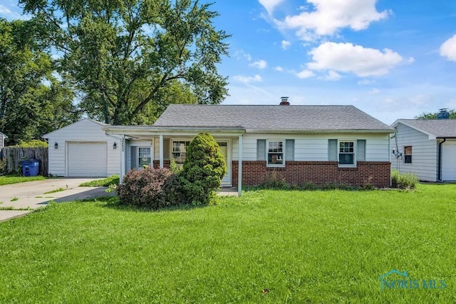 3253 Radford Dr, Toledo, OH 43614 - view of front of house with concrete driveway, brick siding, and an attached garage