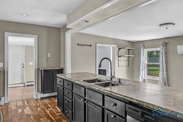 3253 Radford Dr, Toledo, OH 43614 - kitchen featuring wood finished floors, dark cabinets, and dishwasher