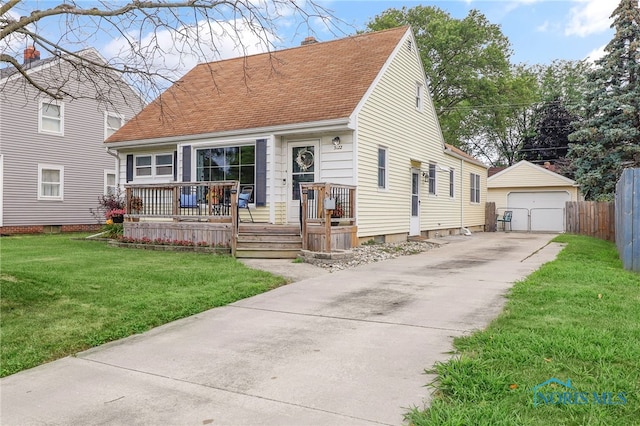 3122 Winston Blvd, Toledo, OH 43614 - cape cod house with an outbuilding, a garage, a shingled roof, covered porch, and a chimney