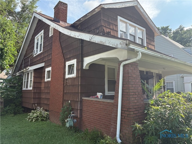 1336 Craigwood Rd, Toledo, OH 43612 - view of home's exterior featuring a chimney and brick siding