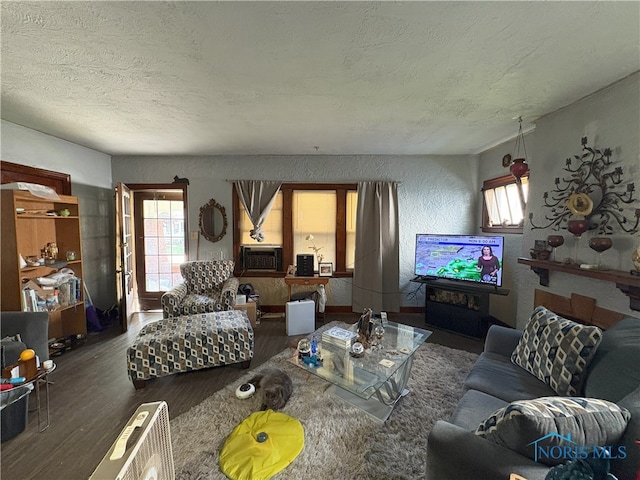 1336 Craigwood Rd, Toledo, OH 43612 - living area featuring wood finished floors, a textured ceiling, plenty of natural light, and cooling unit