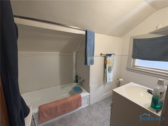 1336 Craigwood Rd, Toledo, OH 43612 - full bathroom with lofted ceiling, vanity, and tile patterned floors