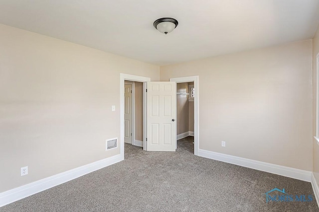 1553 Flormar Ct, Toledo, OH 43612 - unfurnished bedroom with carpet and a spacious closet