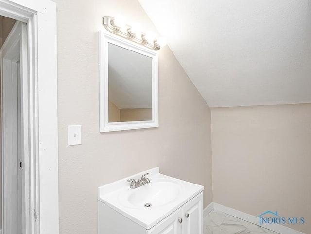 1553 Flormar Ct, Toledo, OH 43612 - bathroom with vanity, marble finish flooring, and lofted ceiling