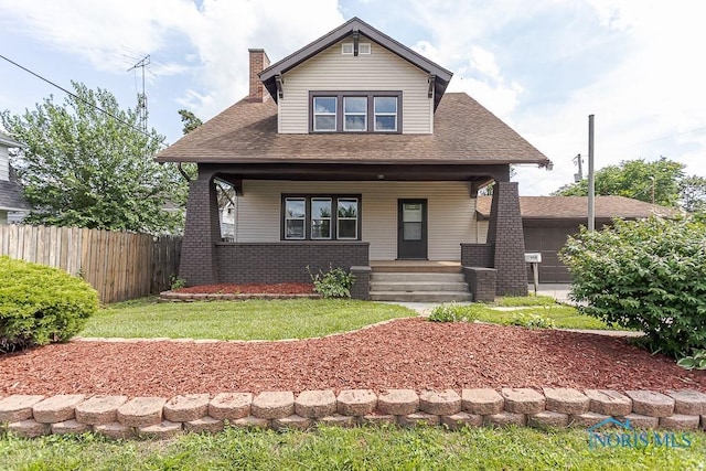 1553 Flormar Ct, Toledo, OH 43612 - view of front of home featuring a porch, a chimney, roof with shingles, and brick siding
