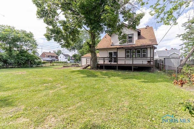 1553 Flormar Ct, Toledo, OH 43612 - back of property featuring a deck, a fenced backyard, roof with shingles, and a chimney