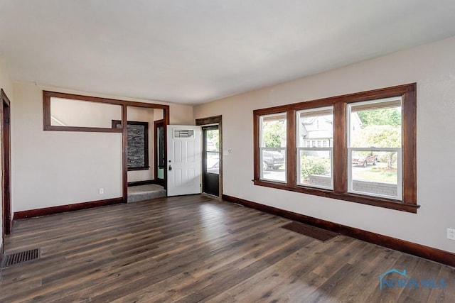 1553 Flormar Ct, Toledo, OH 43612 - empty room featuring plenty of natural light and dark wood-style flooring