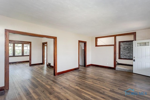 1553 Flormar Ct, Toledo, OH 43612 - spare room featuring dark wood-style floors and baseboards