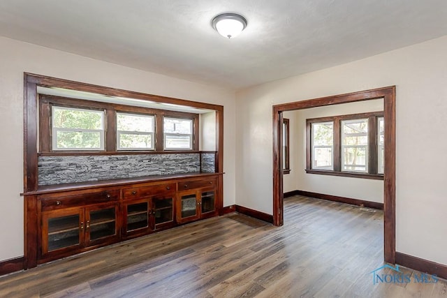1553 Flormar Ct, Toledo, OH 43612 - spare room featuring baseboards and dark wood-style flooring
