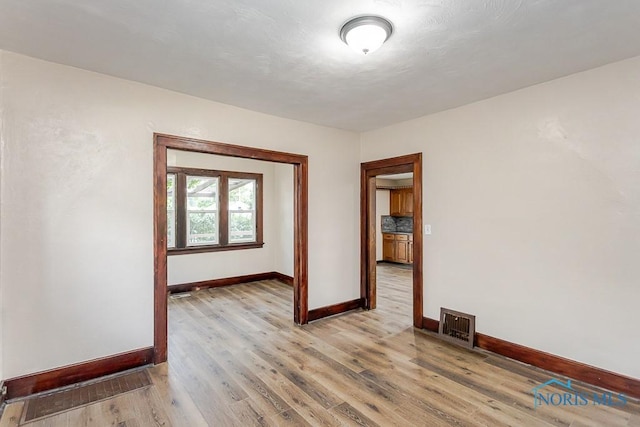1553 Flormar Ct, Toledo, OH 43612 - unfurnished room featuring baseboards and light wood finished floors