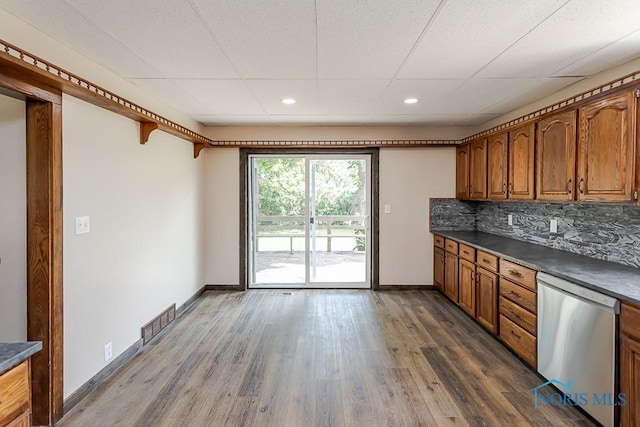 1553 Flormar Ct, Toledo, OH 43612 - kitchen featuring dishwasher, dark countertops, brown cabinetry, dark wood finished floors, and recessed lighting