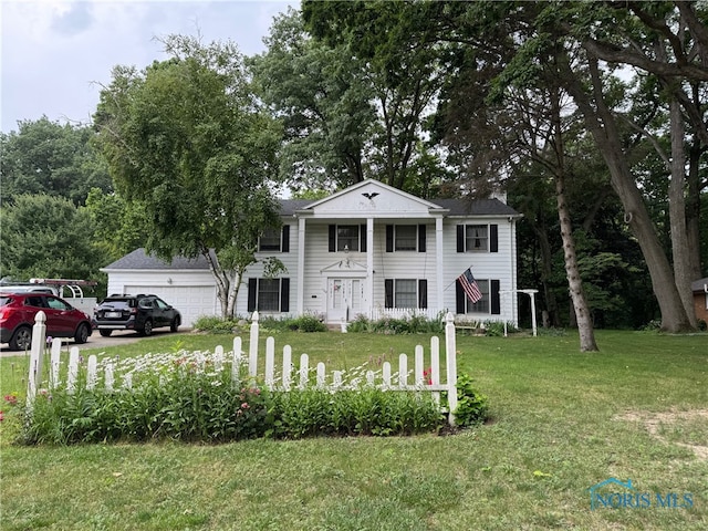 1302 E Beverly Hills Dr, Toledo, OH 43614 - greek revival inspired property featuring a front yard, a garage, and driveway