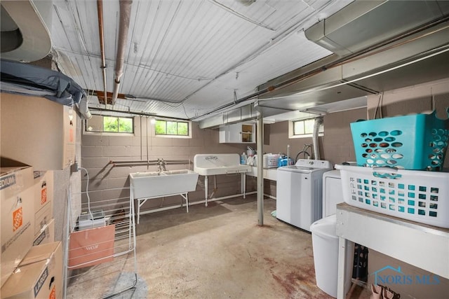 3740 Mapleway Dr, Toledo, OH 43614 - basement featuring washing machine and dryer, healthy amount of natural light, and concrete block wall