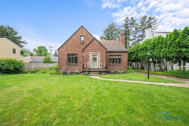 3740 Mapleway Dr, Toledo, OH 43614 - tudor home featuring brick siding and a chimney