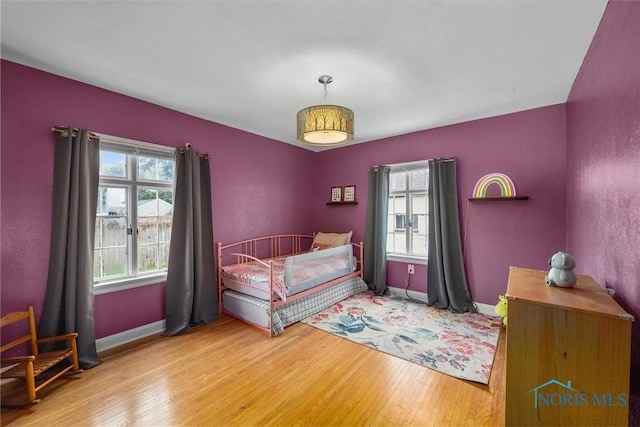 3740 Mapleway Dr, Toledo, OH 43614 - bedroom featuring multiple windows and wood finished floors
