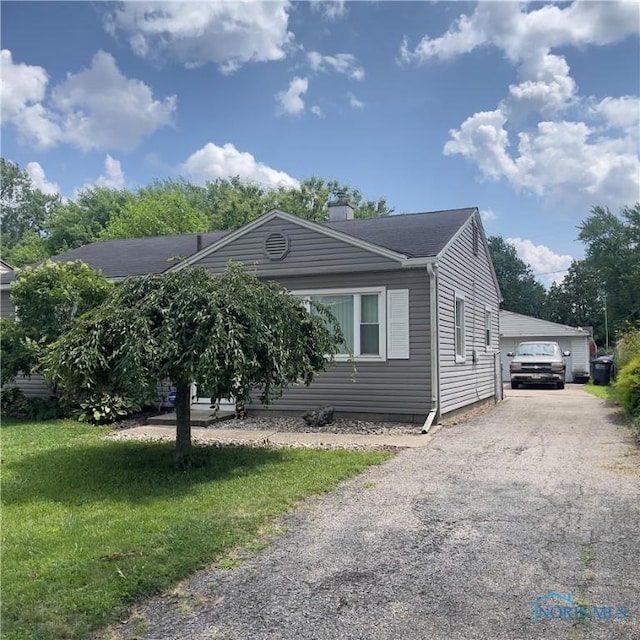 415 W Northgate Pkwy, Toledo, OH 43612 - view of front of house with a chimney, a front yard, and a garage