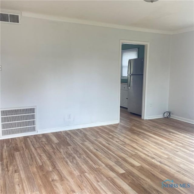 415 W Northgate Pkwy, Toledo, OH 43612 - empty room featuring crown molding and light wood-style floors