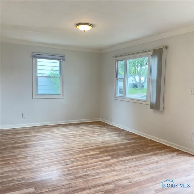 415 W Northgate Pkwy, Toledo, OH 43612 - spare room featuring ornamental molding and light wood-style flooring