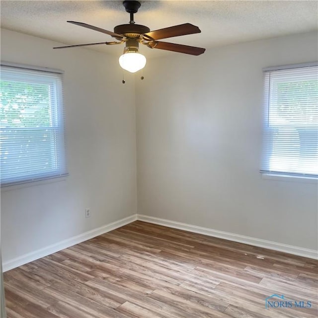 415 W Northgate Pkwy, Toledo, OH 43612 - empty room featuring wood finished floors, a textured ceiling, and ceiling fan