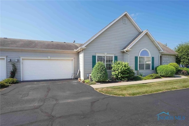 7673 Brookstone Dr Unit U7673, Findlay, OH 45840 - ranch-style home featuring driveway and an attached garage