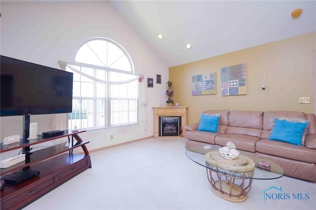 7673 Brookstone Dr Unit U7673, Findlay, OH 45840 - carpeted living area with vaulted ceiling, a glass covered fireplace, and recessed lighting