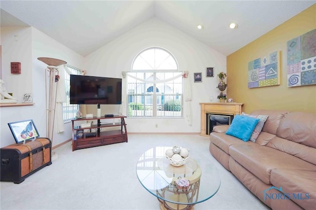 7673 Brookstone Dr Unit U7673, Findlay, OH 45840 - carpeted living room with lofted ceiling, recessed lighting, and a glass covered fireplace