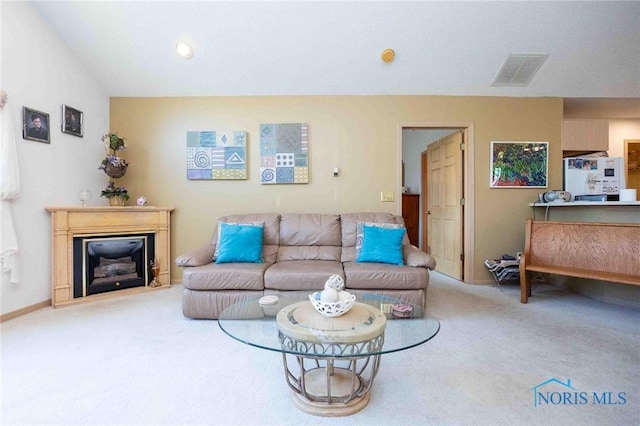 7673 Brookstone Dr Unit U7673, Findlay, OH 45840 - living area with carpet and a glass covered fireplace