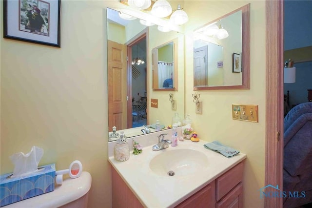 7673 Brookstone Dr Unit U7673, Findlay, OH 45840 - ensuite bathroom featuring vanity and a chandelier