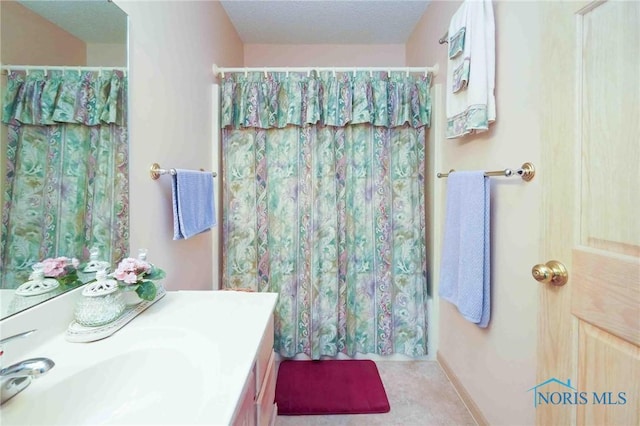 7673 Brookstone Dr Unit U7673, Findlay, OH 45840 - bathroom featuring vanity and curtained shower