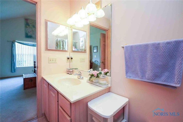 7673 Brookstone Dr Unit U7673, Findlay, OH 45840 - bathroom with vanity and a chandelier