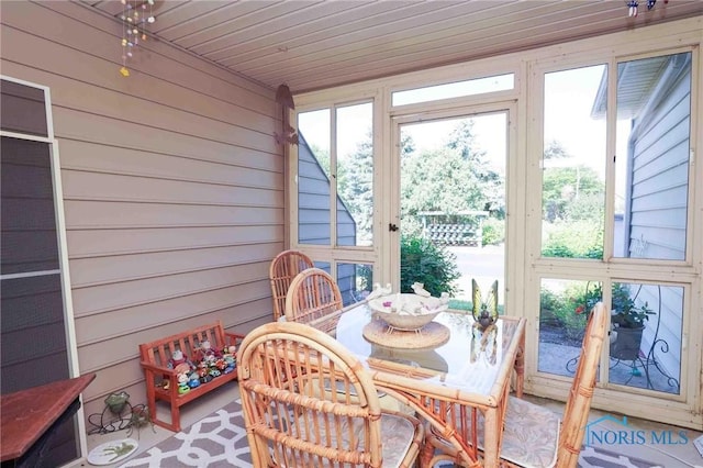 7673 Brookstone Dr Unit U7673, Findlay, OH 45840 - sunroom with healthy amount of natural light and wooden walls