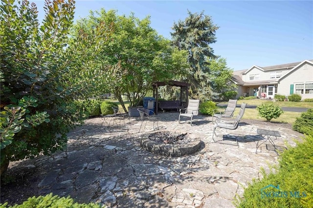 7673 Brookstone Dr Unit U7673, Findlay, OH 45840 - view of patio / terrace with a gazebo and an outdoor fire pit