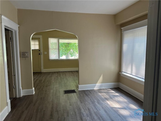 540 E Central Ave, Toledo, OH 43608 - spare room with wood finished floors and arched walkways