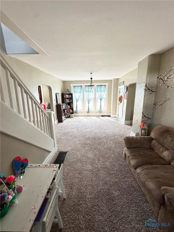 201 E Saffell Ave, Sycamore, OH 44882 - living room with carpet flooring and stairs