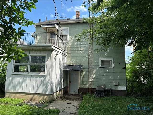 1623 W Central Ave, Toledo, OH 43606 - rear view of house featuring a balcony and a chimney
