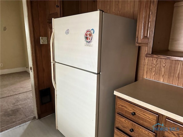 1623 W Central Ave, Toledo, OH 43606 - kitchen featuring freestanding refrigerator, brown cabinetry, and light countertops