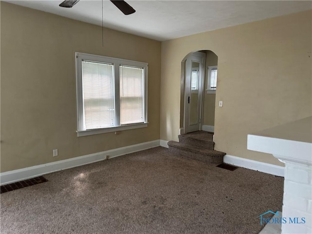 1623 W Central Ave, Toledo, OH 43606 - empty room with arched walkways, ceiling fan, and carpet