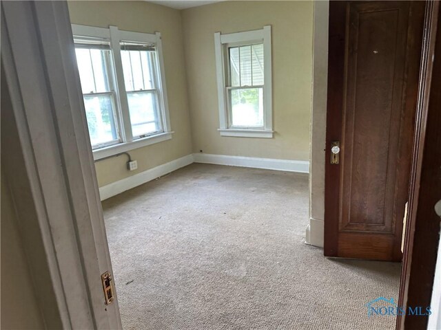 1623 W Central Ave, Toledo, OH 43606 - unfurnished room featuring light colored carpet and baseboards